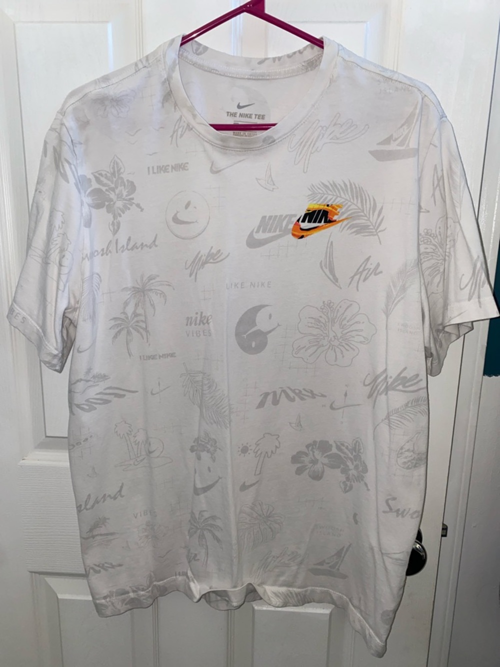 Nike Men’s White Short-Sleeve Graphic Logo Tee with Orange Accent